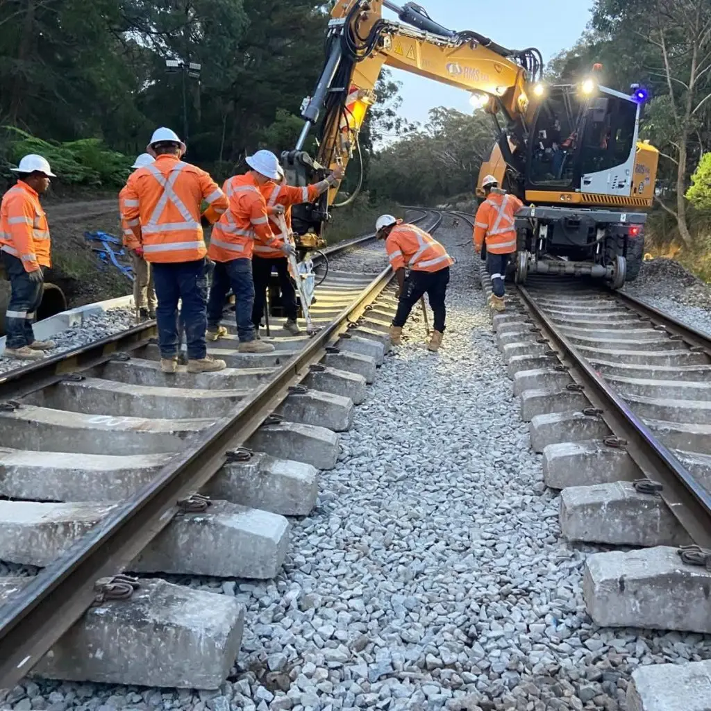 Rail crew completing railway track renewal works in Australia