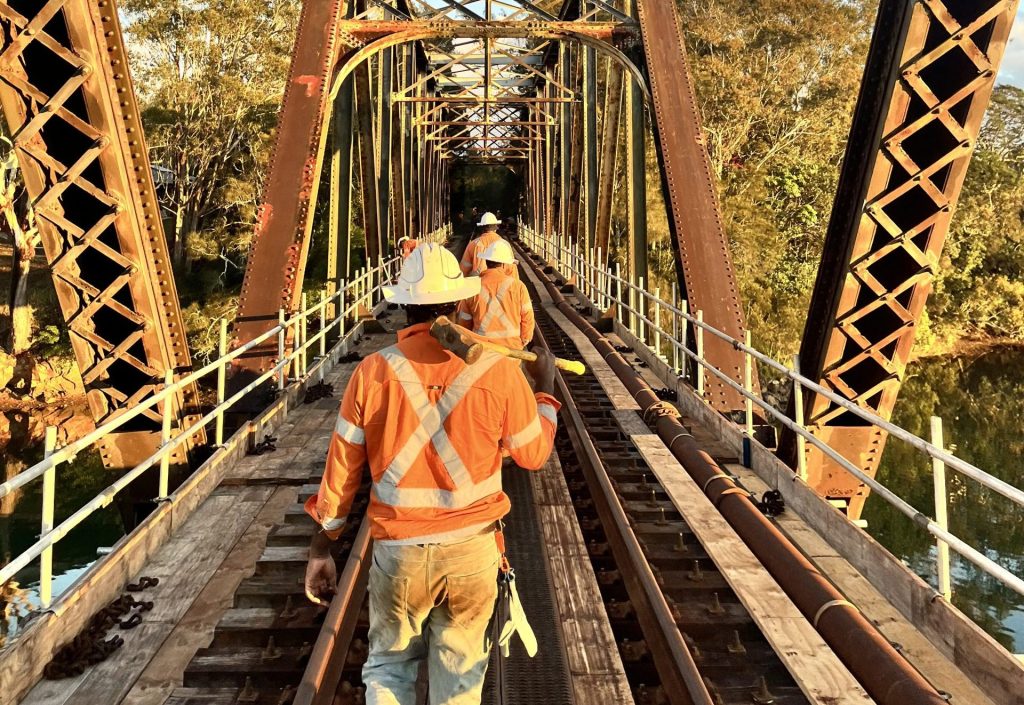 Rail maintenance crew inspecting track condition on an Australian rail corridor