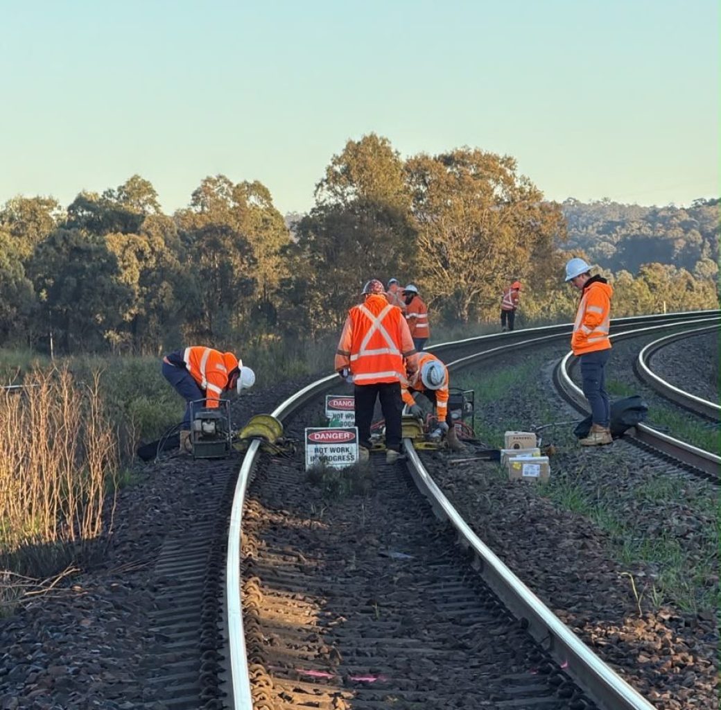 Crew completing turnout maintenance during a planned rail possession