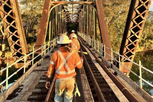 Rail maintenance crew inspecting track condition on an Australian rail corridor