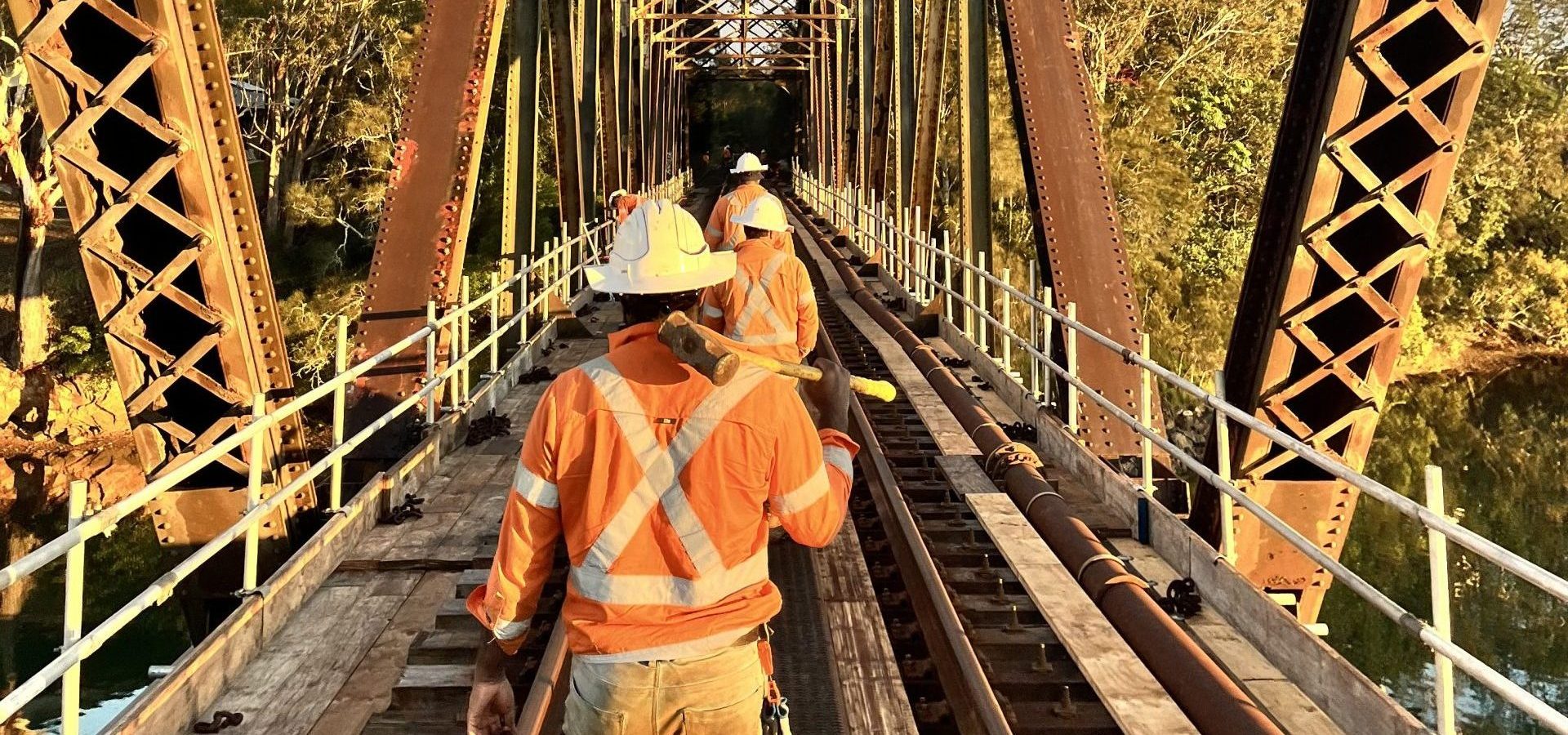 Rail maintenance crew inspecting track condition on an Australian rail corridor